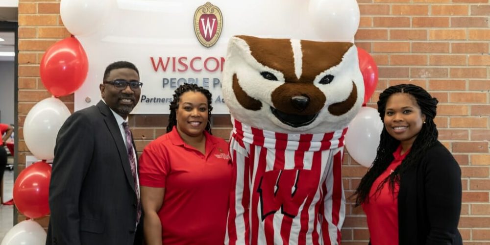 PEOPLE staff members pose with Bucky Badger