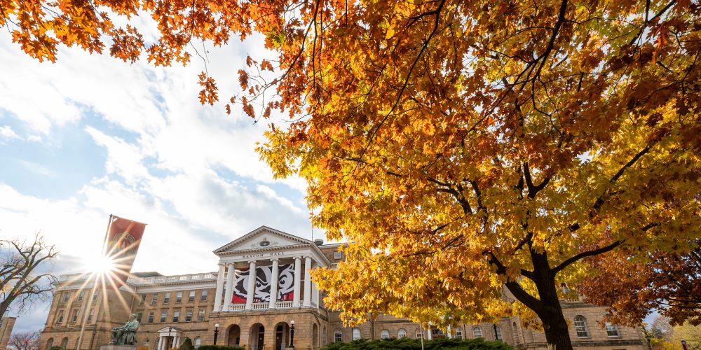 Pedestrians and students walk among the colors of the fall leaves near Bascom Hall at the University of Wisconsin-Madison during autumn on November 11, 2021. (Photo by Bryce Richter / UW-Madison)