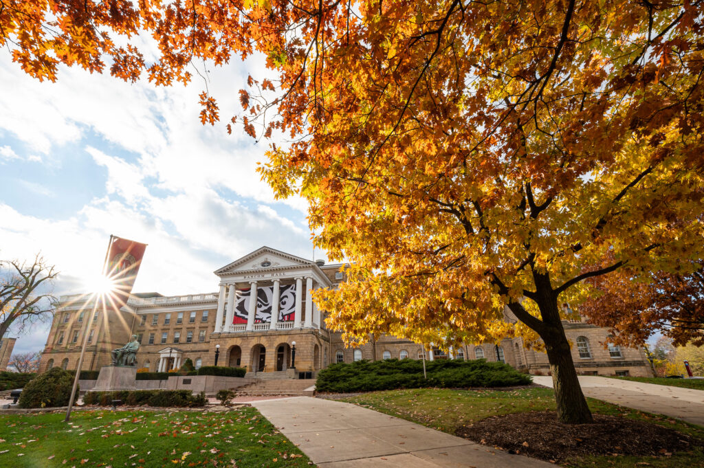 Pedestrians and students walk among the colors of the fall leaves near Bascom Hall at the University of Wisconsin-Madison during autumn on November 11, 2021. (Photo by Bryce Richter / UW-Madison)