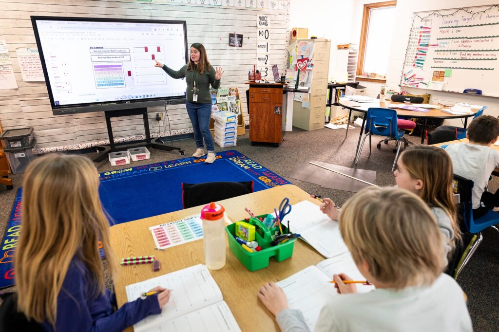 Teacher Mackenzie Straub, a 2021 graduate of the University of Wisconsin–Madison School of Education, teaches third-grade children in her classroom at Gibraltar Elementary School in Fish Creek, Wis., on Feb. 7, 2025