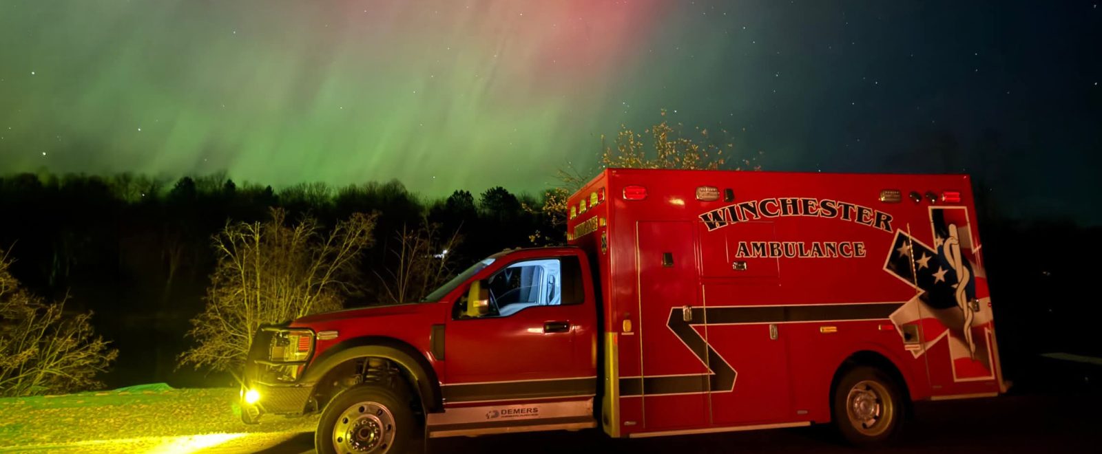 A red ambulance with the words 